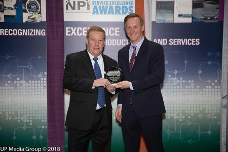 Mark Brawley, President of Speedprint, receives the Service Excellence Award 2018 from Circuits Assembly editor Mike Buetow.